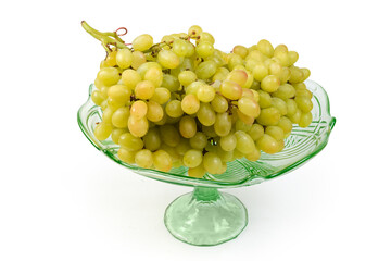 Sultana grapes cluster in vintage glass vase for fruits