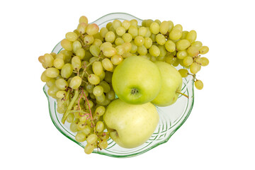 Sultana grapes and apples in glass fruits bowl, top view