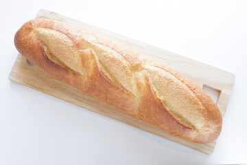 Loaf of French bread on wooden cutting board