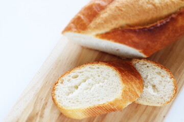 French bread, loaf on wooden board