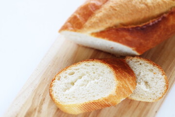French bread, loaf on wooden board