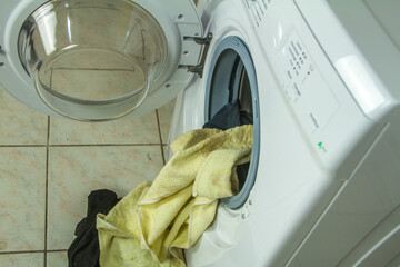 close up top view of a washing machine door in operation