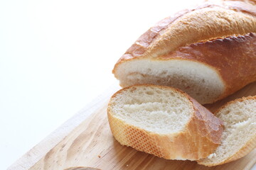 French bread, loaf on wooden board