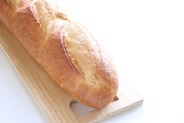 French bread, loaf on wooden board