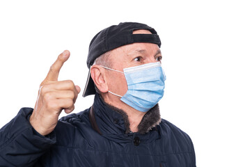  Senior man in protective mask  posing in studio over white background