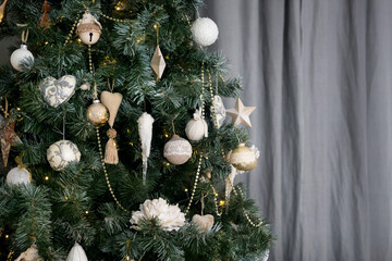 Christmas tree on a gray background. garland, white balls