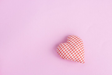 Minimalistic background for the celebration of Valentine's Day. Happy holiday greetings concept. Place for text. Flat layout.