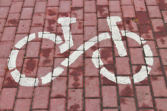 Bicycle lane mark. White sign for bicycle. Bike path with a symbol of bike.
