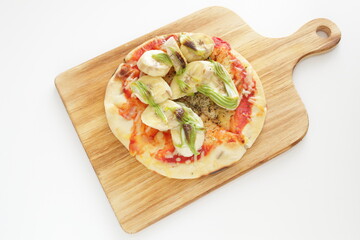 banana and Macha cream pizza on wooden board 