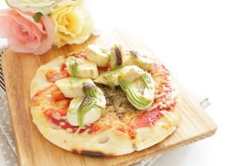 banana and Macha cream pizza on wooden board 
