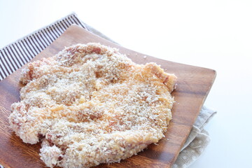 breadcrumbs and pork for Milano cutlet prepared for cooking