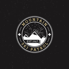 Camping Label. Vintage Mountain ski patrol round patch. Outdoor adventure logo design. Travel retro...