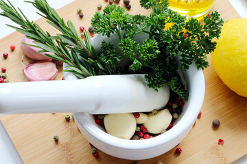 mortar filled with fresh herbs