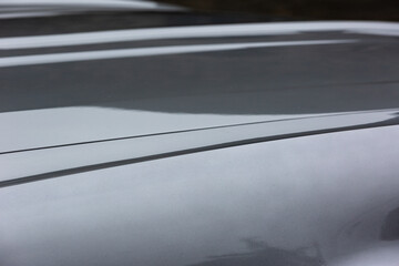 Shiny gray bonnet of a classic car - pattern