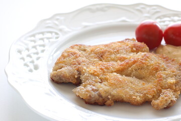 Homemade Milino cutlet on dish with copy space