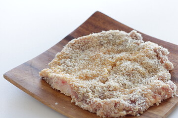 breadcrumbs and pork for Milano cutlet prepared for cooking