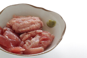 Assorted tuna fish and spice Wasabi in bowl with copy space