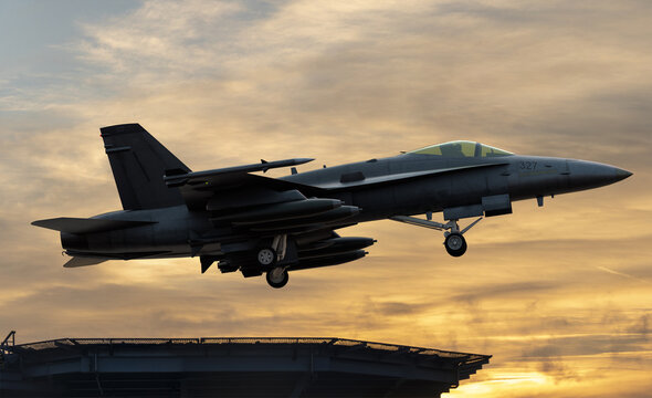 Boeing Super Hornet taking off from the deck of an aircraft carrier