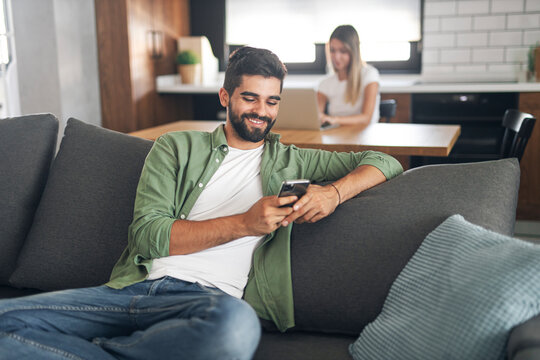 Attractive young man using cellphone