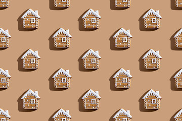 Christmas bakery pattern. Festive food decor. Homemade cookies illustration. Gingerbread biscuit house figures with white icing isolated on beige background.