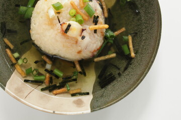 Japanese food, homemade grilled rice ball in dashi broth with spring onion
