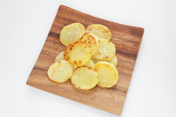 homemade fried potato on wooden plate with copy space