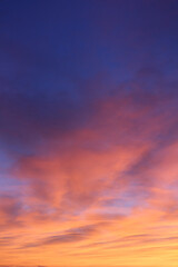 Fototapeta na wymiar Yellow, orange, dark blue vertical morning sky background