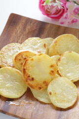 homemade fried potato on wooden plate with copy space