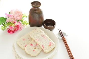 Japanese food, red ginger in fish cake and Sake