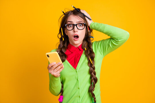 Photo of shocked girl messy hairdo hold smartphone shout isolated shine color background