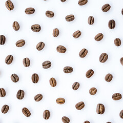 Pattern of roasted coffee beans arrange on white background