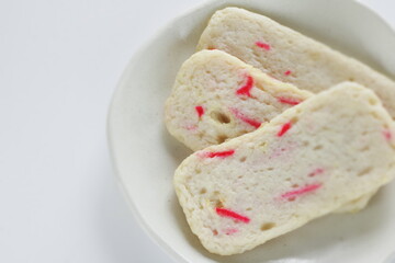Japanese food, red ginger in fish cake on white dish