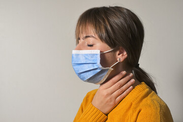Woman Wearing Medical Mask and Throat Pain