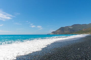 Nonza Beach in Corsica under a great blue sky