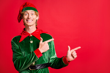 Photo of positive elf guy point finger empty space x-mas christmas adverts wear belt cap costume...