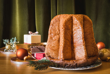 Pandoro traditional Italian Christmas cake on festive table still life.