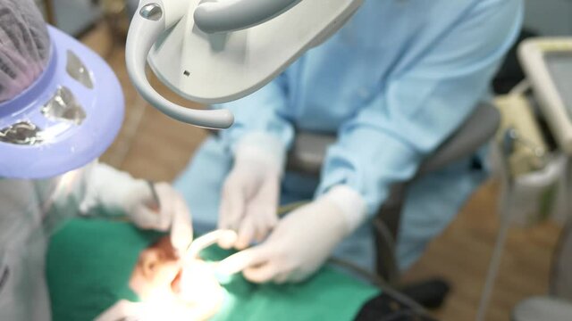 check the teeth with the dentist, selective focus at light, follow up healthy concept.