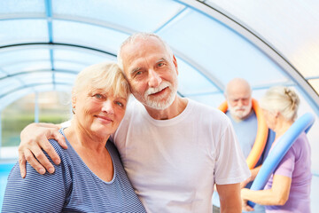 Amorous senior couple in a swimming pool