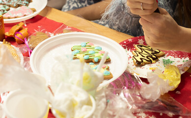 Gingerbread in the shape of Christmas tree is ready to decorate with glaze. Decorating gingerbreads, step 7. Preparing for the Christmas or New Year concept. Xmas at home concept.