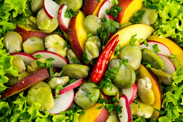Healthy vegetable salad, lettuce, broad bean, radish, bell pepper, top view