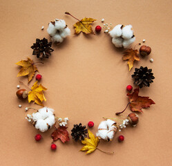 Autumn decoration with cotton flowers and dry leaves