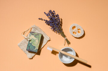 Top view of different hygiene and care items on cream color background, zero waste concept.