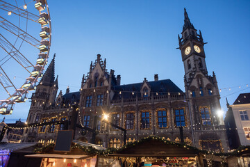 Christmas market in Europe, Ghent, Belgium. Main town square with decorated tree and lights....
