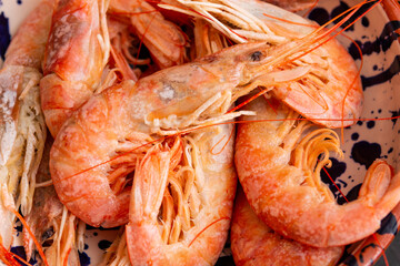 freshly cooked prawns served with lemon