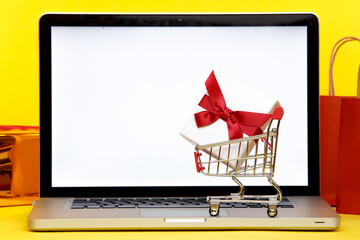 Tula, 28 09 19: Online christmas shopping concept on the laptop display. White screen
