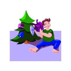 Boy with a gift near Christmas tree