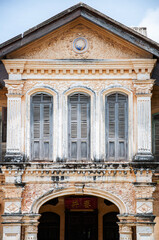Old Phuket Sino Portuguese house classic facade with stuccowork in Phuket Old town area. Thailand