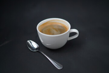 cup of coffee on black background