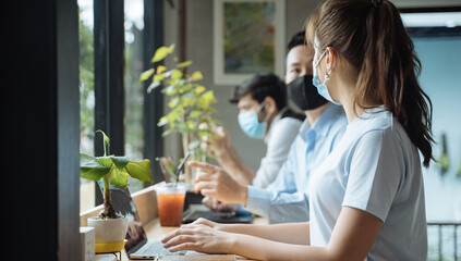 Asian people wearing mask working at coffee shop