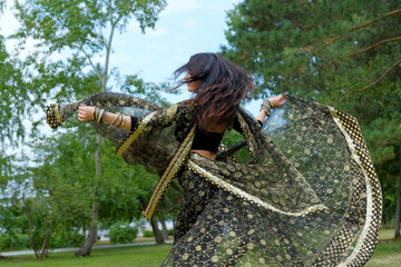 Woman in ethnic indian costume with jewellery and traditional makeup.